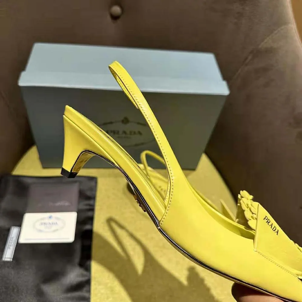 Prada Brushed Leather Slingback Pumps with Floral Appliques for Women in Yellow