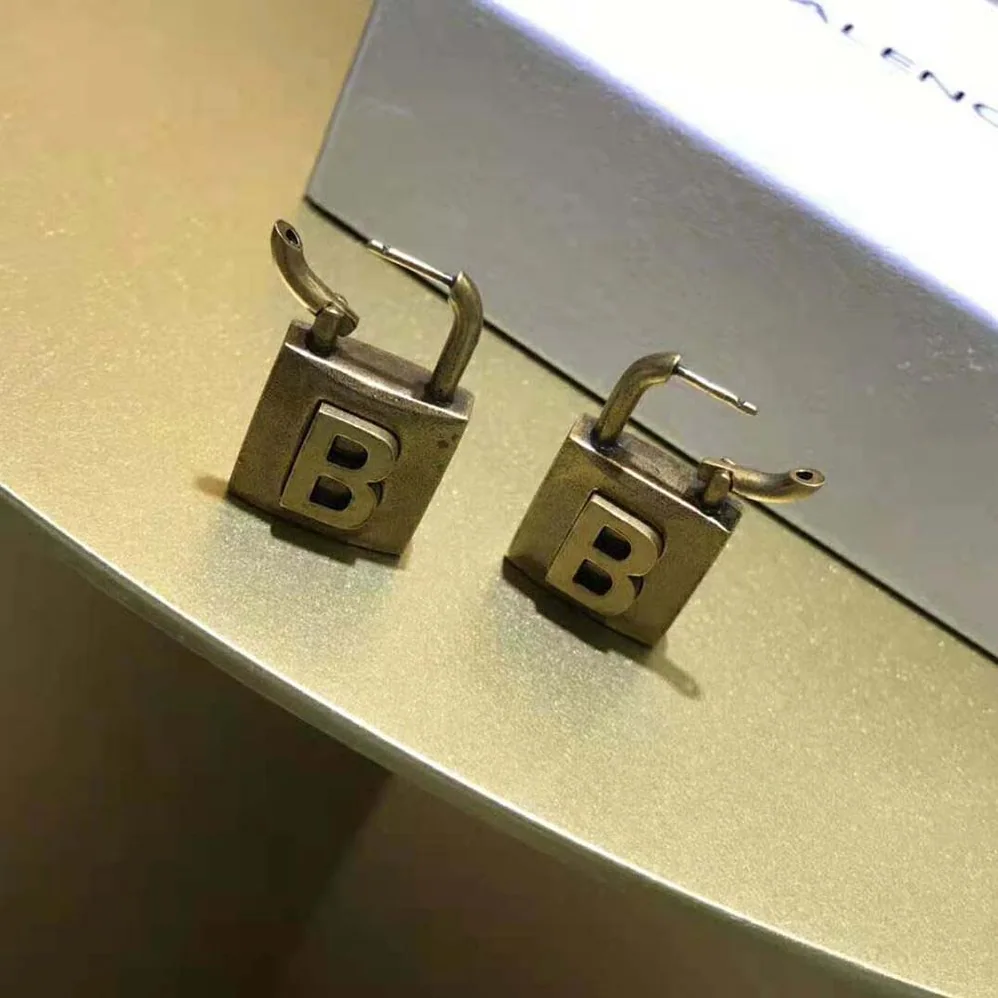 Balenciaga Lock Small Earrings in Aged for Women in Gold Brass Balenciaga Lock Small Earrings in Aged for Women in Gold Brass