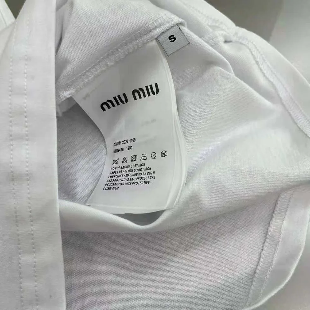 Miu Miu Embroidered Cotton T-shirt with Embroidered Logo for Women in White Miu Miu Embroidered Cotton T-shirt with Embroidered Logo for Women in White