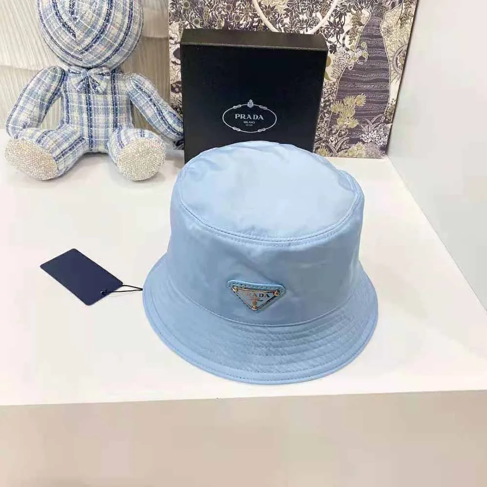 Prada Nylon Bucket Hat Decorated with the Triangle Logo for Women in Blue Prada Nylon Bucket Hat Decorated with the Triangle Logo for Women in Blue