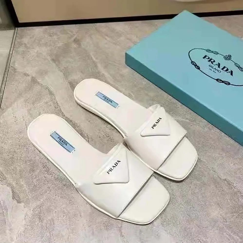 Prada Brushed Leather Slides Triangle Logo for Women in White Prada Brushed Leather Slides Triangle Logo for Women in White