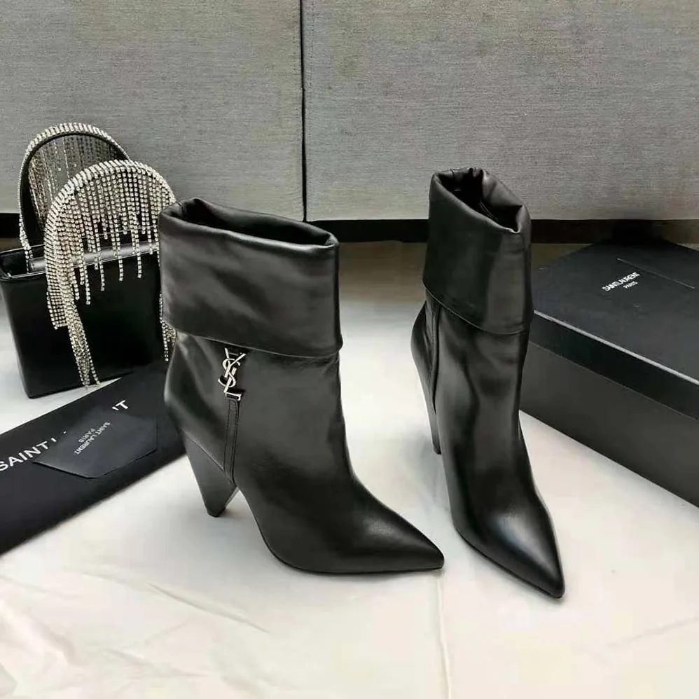 Saint Laurent YSL Niki Booties in Smooth Leather and Silver-Tone Monogram for Women in Black Saint Laurent YSL Niki Booties in Smooth Leather and Silver-Tone Monogram for Women in Black