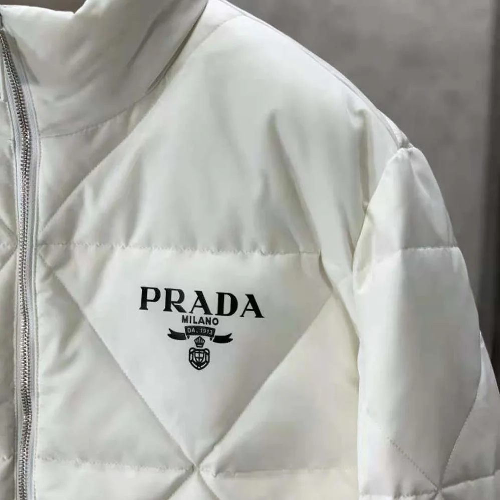 Prada Re-Nylon Down Jacket for Women in White Prada Re-Nylon Down Jacket for Women in White