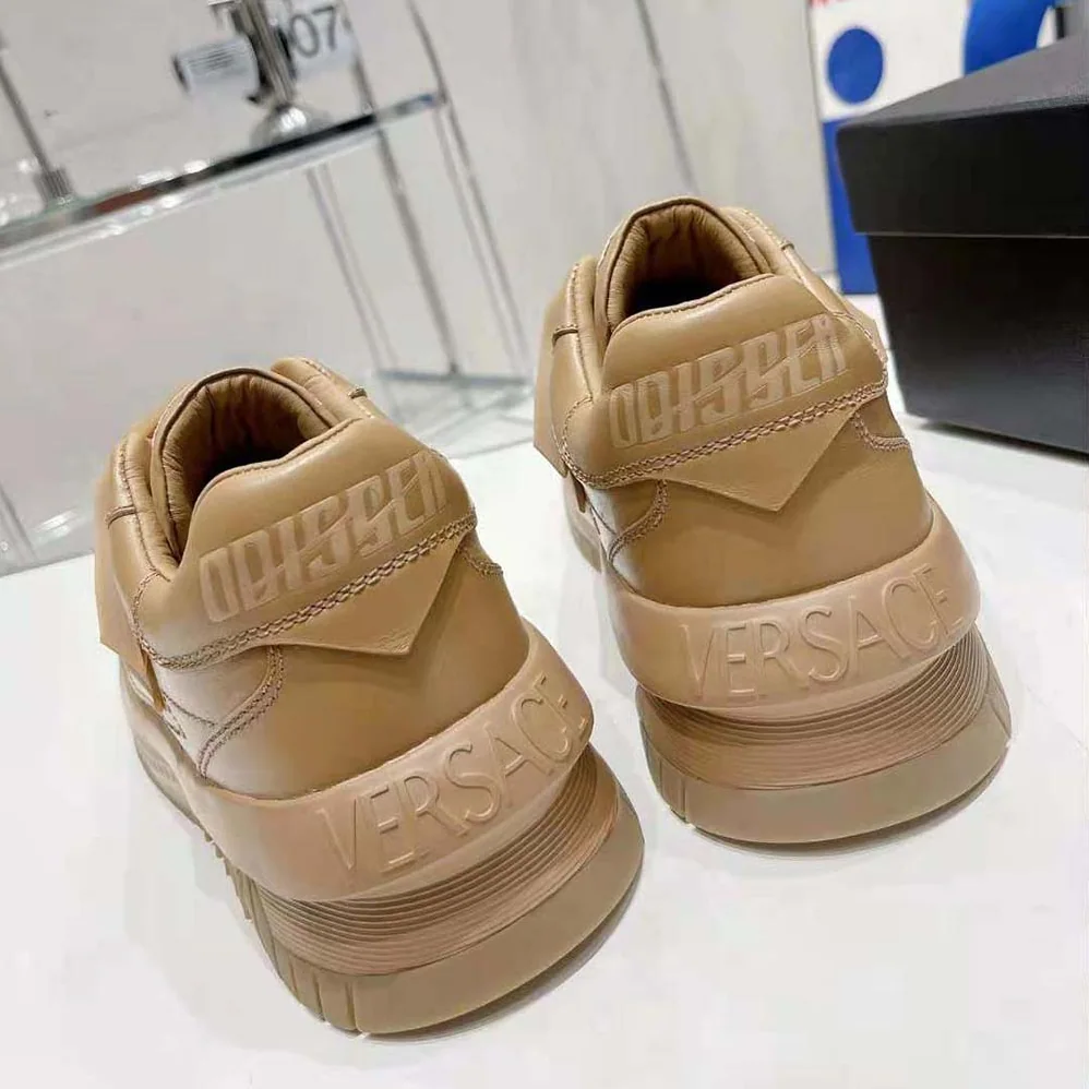 Versace Odissea Sneakers are Set on Rubber Soles with Perforated Toe Caps for Unisex in Brown Versace Odissea Sneakers are Set on Rubber Soles with Perforated Toe Caps for Unisex in Brown