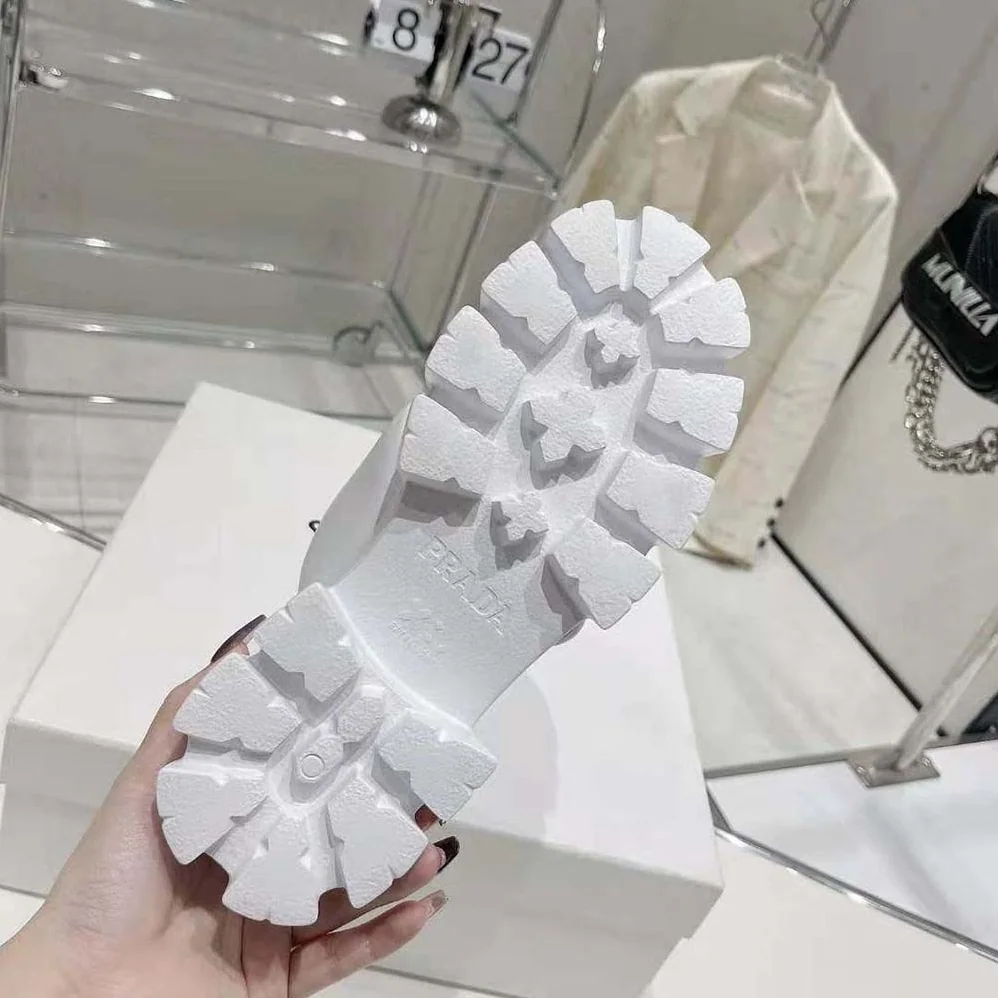 Prada Monolith Padded Nappa Leather Sandals for Women in White Prada Monolith Padded Nappa Leather Sandals for Women in White
