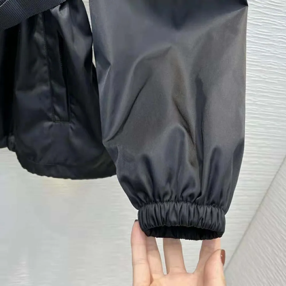 Prada Re-Nylon Hooded Blouson Jacket with Pouch for Women in Black Prada Re-Nylon Hooded Blouson Jacket with Pouch for Women in Black
