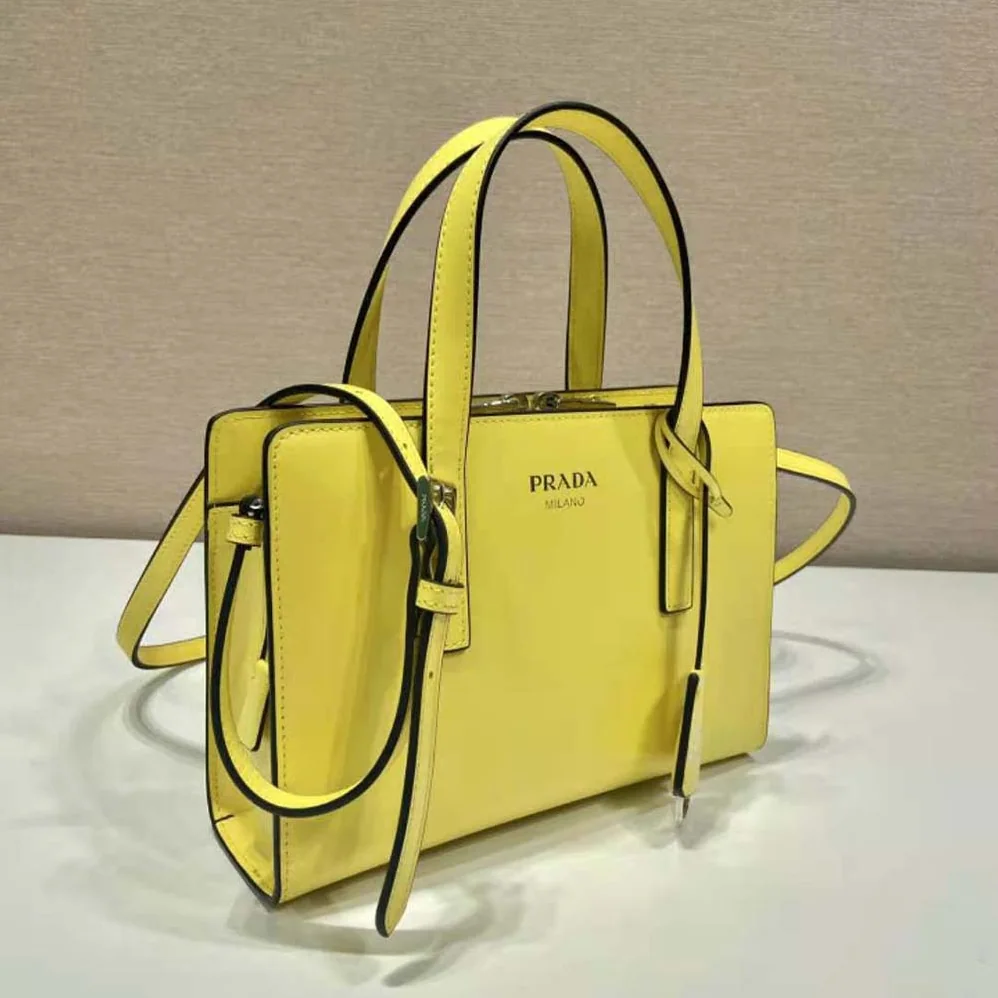 Prada Re-Edition 1995 Brushed-Leather Mini Handbag for Women in Yellow Prada Re-Edition 1995 Brushed-Leather Mini Handbag for Women in Yellow