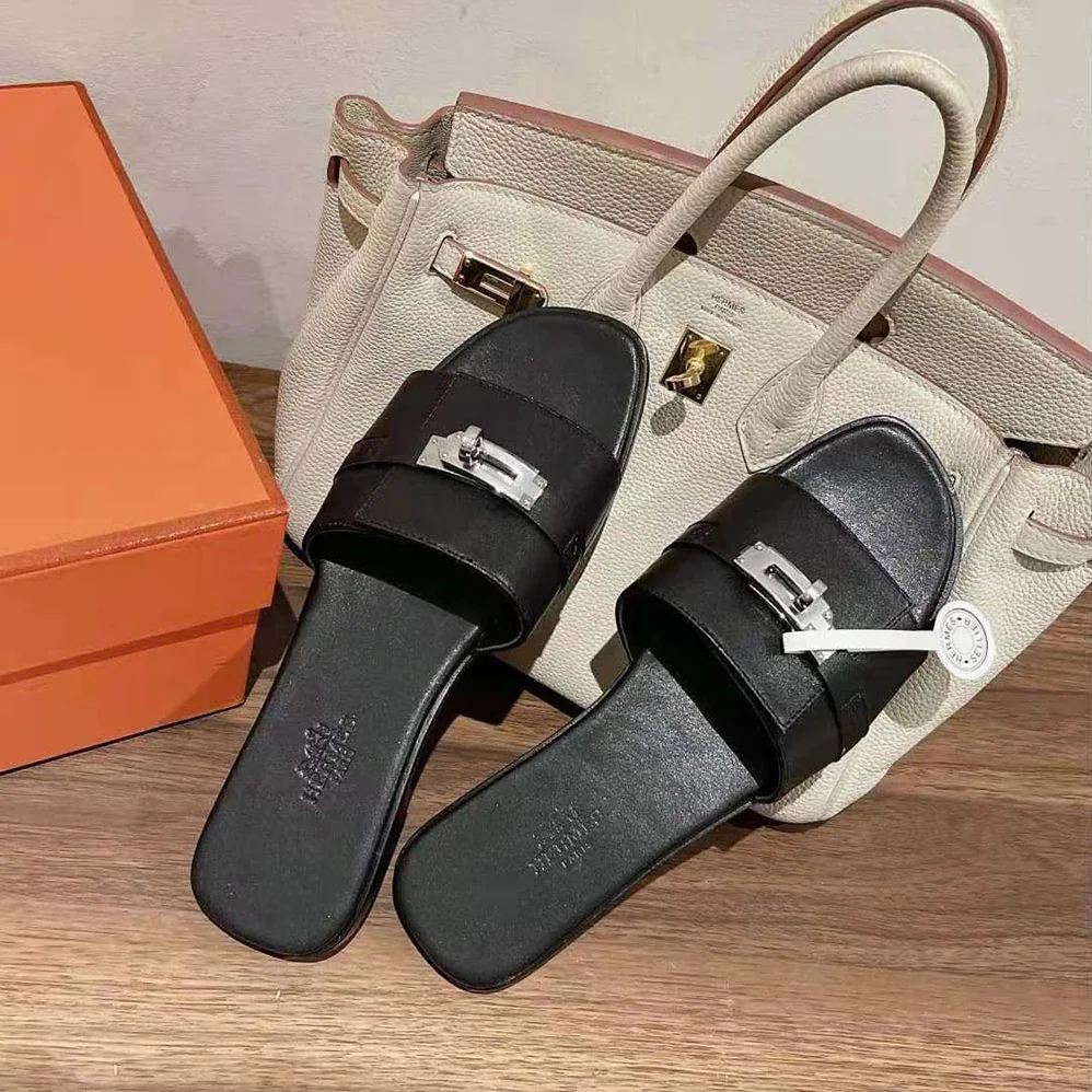 Hermes Giulia Sandal in Calfskin with Iconic Palladium-Plated Kelly Buckle for Women in Black Hermes Giulia Sandal in Calfskin with Iconic Palladium-Plated Kelly Buckle for Women in Black