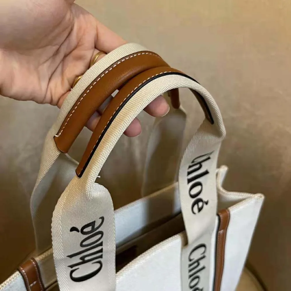Chloe Medium Woody Tote Bag in Cotton Canvas and Shiny Calfskin with Woody Ribbo for Women in Brown Chloe Medium Woody Tote Bag in Cotton Canvas and Shiny Calfskin with Woody Ribbo for Women in Brown