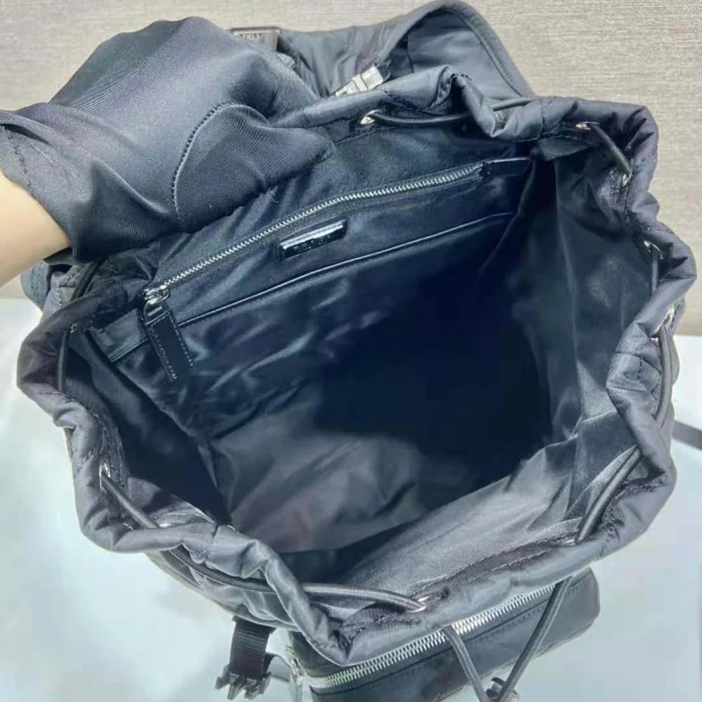 Prada Re-Nylon Backpack with Topstitching for Men in Black Prada Re-Nylon Backpack with Topstitching for Men in Black