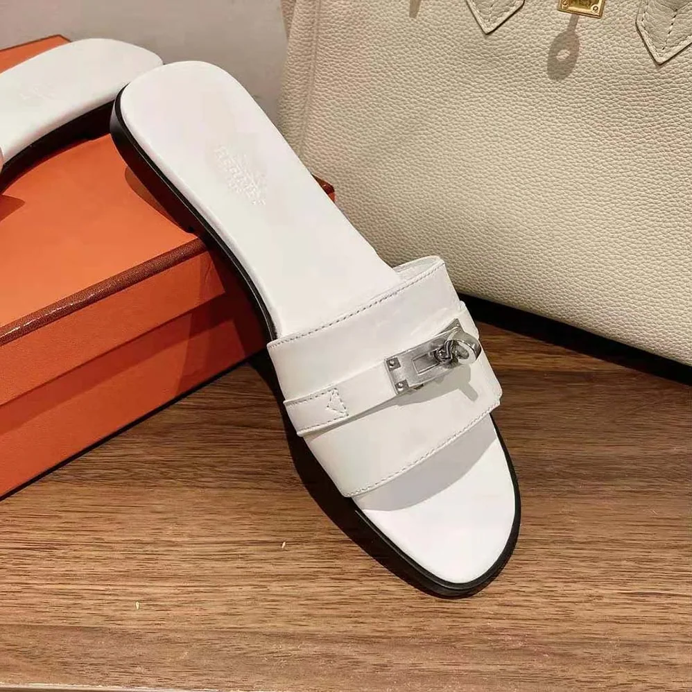 Hermes Giulia Sandal in Calfskin with Iconic Palladium-Plated Kelly Buckle for Women in White Hermes Giulia Sandal in Calfskin with Iconic Palladium-Plated Kelly Buckle for Women in White
