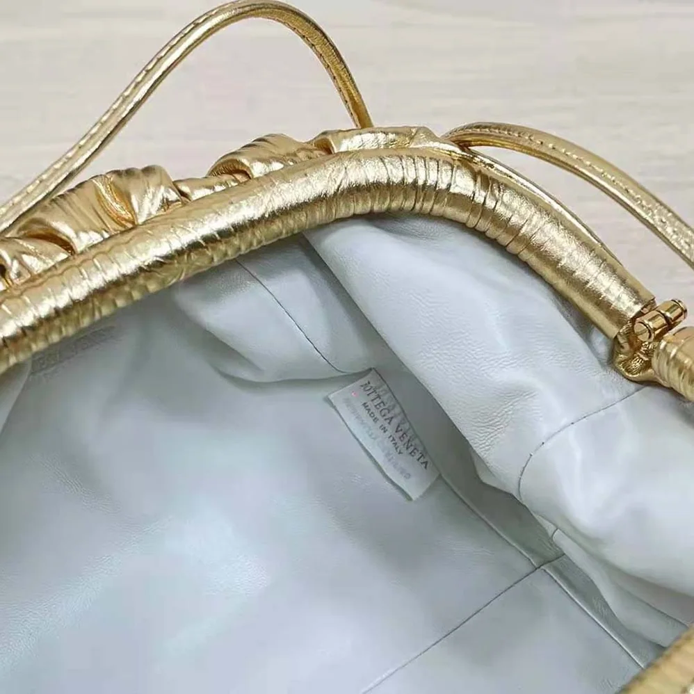 Bottega Veneta Pouch Metalized Leather Clutch for Women in Gold
