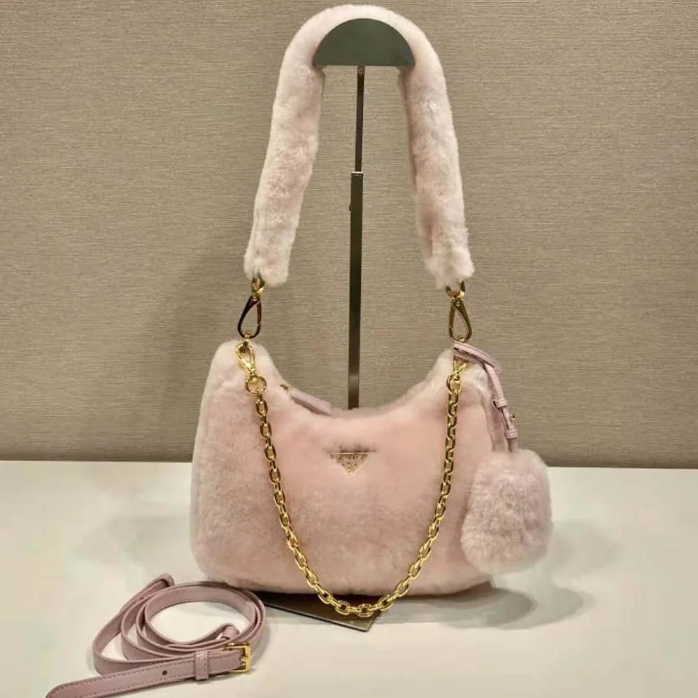Prada Shearling Mini-Bag with the Enameled Metal Triangle Logo for Women in Pink Prada Shearling Mini-Bag with the Enameled Metal Triangle Logo for Women in Pink