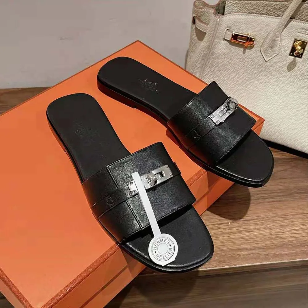 Hermes Giulia Sandal in Calfskin with Iconic Palladium-Plated Kelly Buckle for Women in Black Hermes Giulia Sandal in Calfskin with Iconic Palladium-Plated Kelly Buckle for Women in Black
