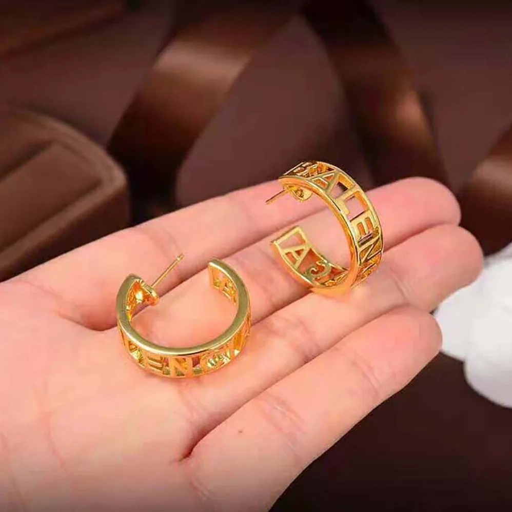 Balenciaga Logo Earrings in Gold Brass for Women