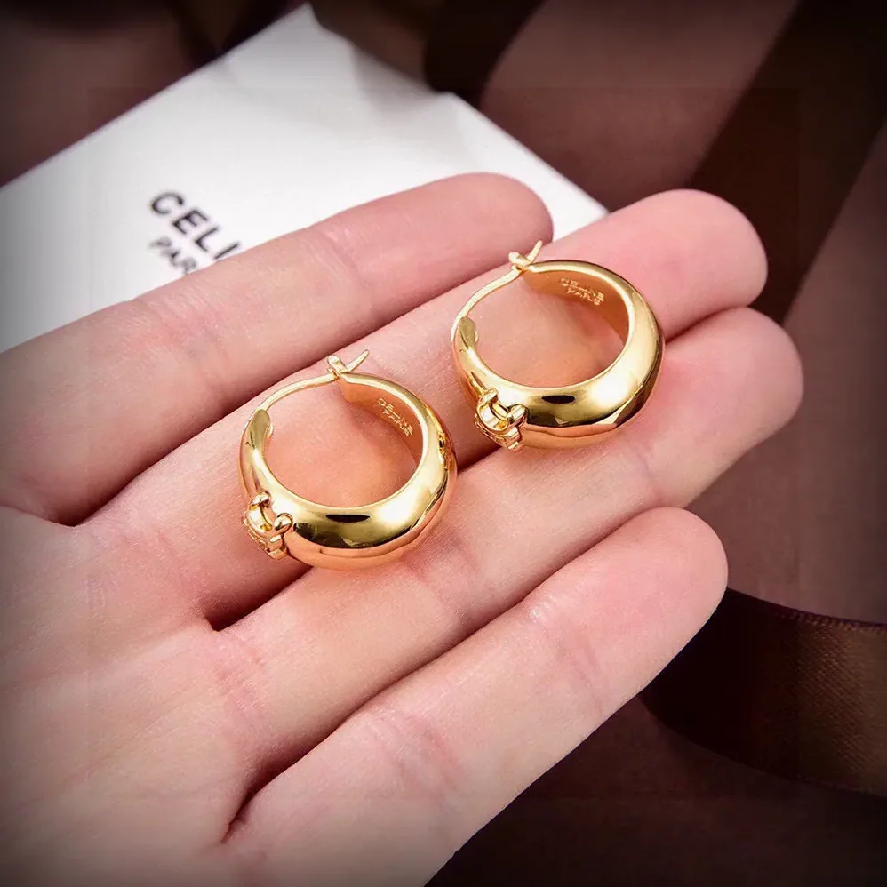 Celine Triomphe Bold Hoops in Brass with Gold Finish for Women