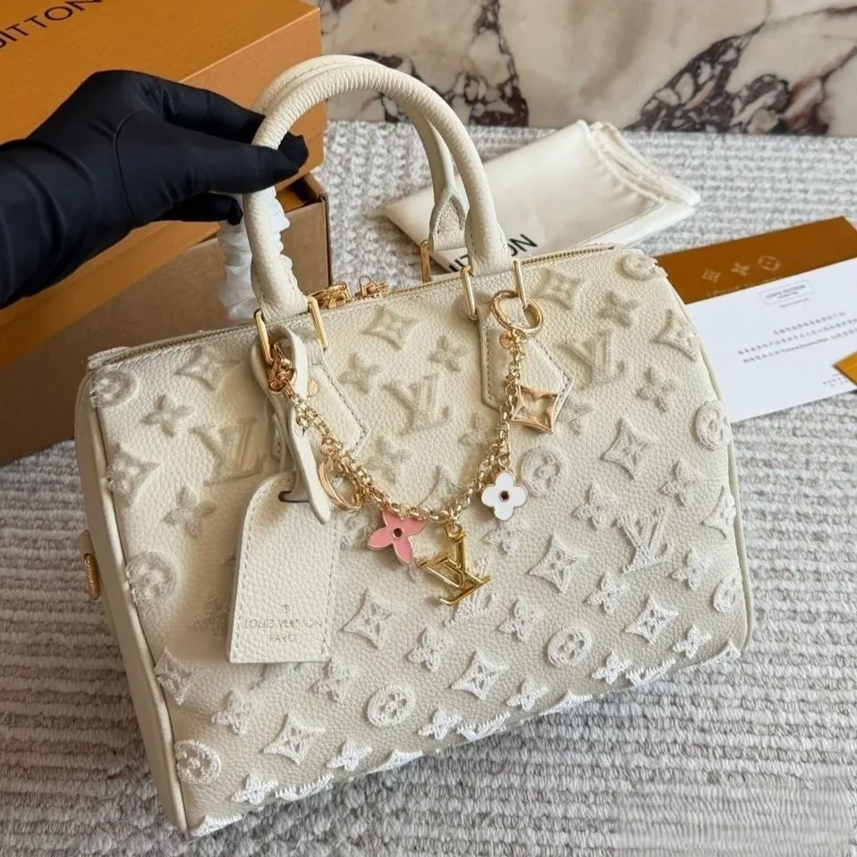 Louis Vuitton Speedy Bandouliere 25 Top Handle Bag in Cream Gold Hardware Louis Vuitton Speedy Bandouliere 25 Top Handle Bag in Cream Gold Hardware