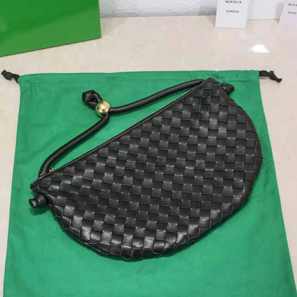 Bottega Veneta Turn Medium Intrecciato Leather Pouch with Adjustable Strap for Women in Black