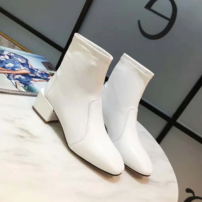 Stuart Weitzman Shoes The Accordion Bootie 40mm Heel for Women in White Stuart Weitzman Shoes The Accordion Bootie 40mm Heel for Women in White