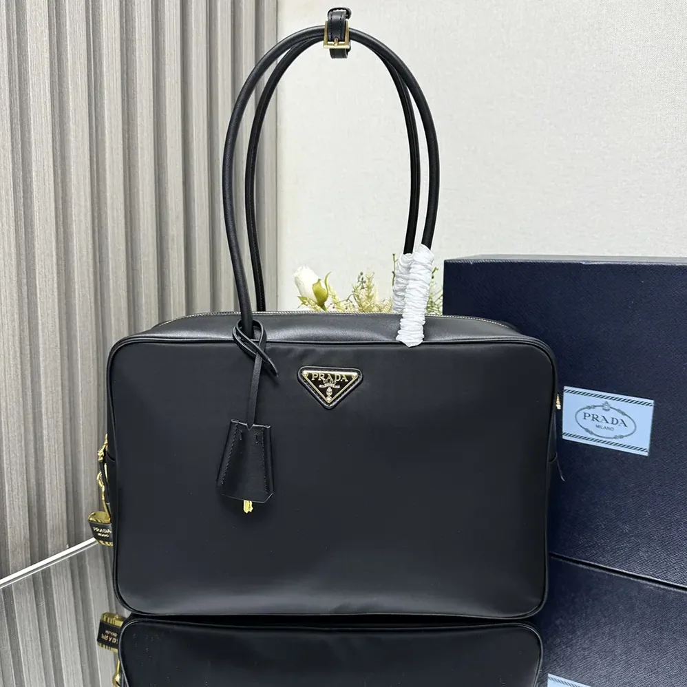 Prada Large Re-Nylon and Leather Top for Women in handle Bag with Padlock Prada Large Re-Nylon and Leather Top for Women in handle Bag with Padlock