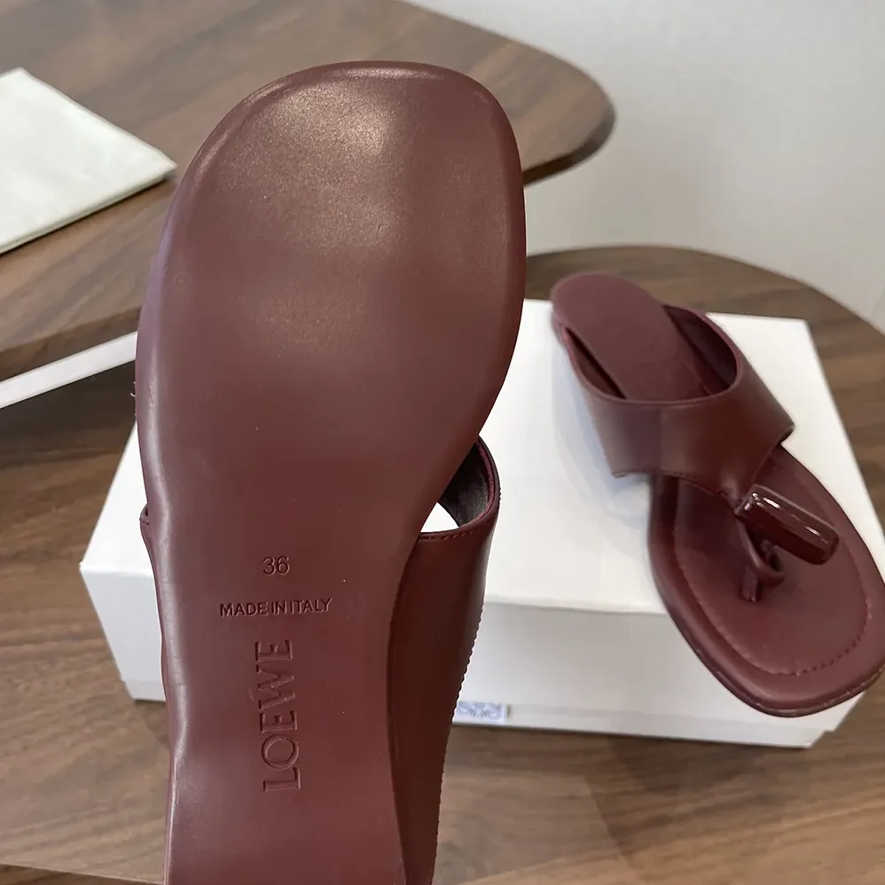 Loewe Toggle Flat Sandal in Shiny Smoot Calfskin for Women in Burnt Red Loewe Toggle Flat Sandal in Shiny Smoot Calfskin for Women in Burnt Red