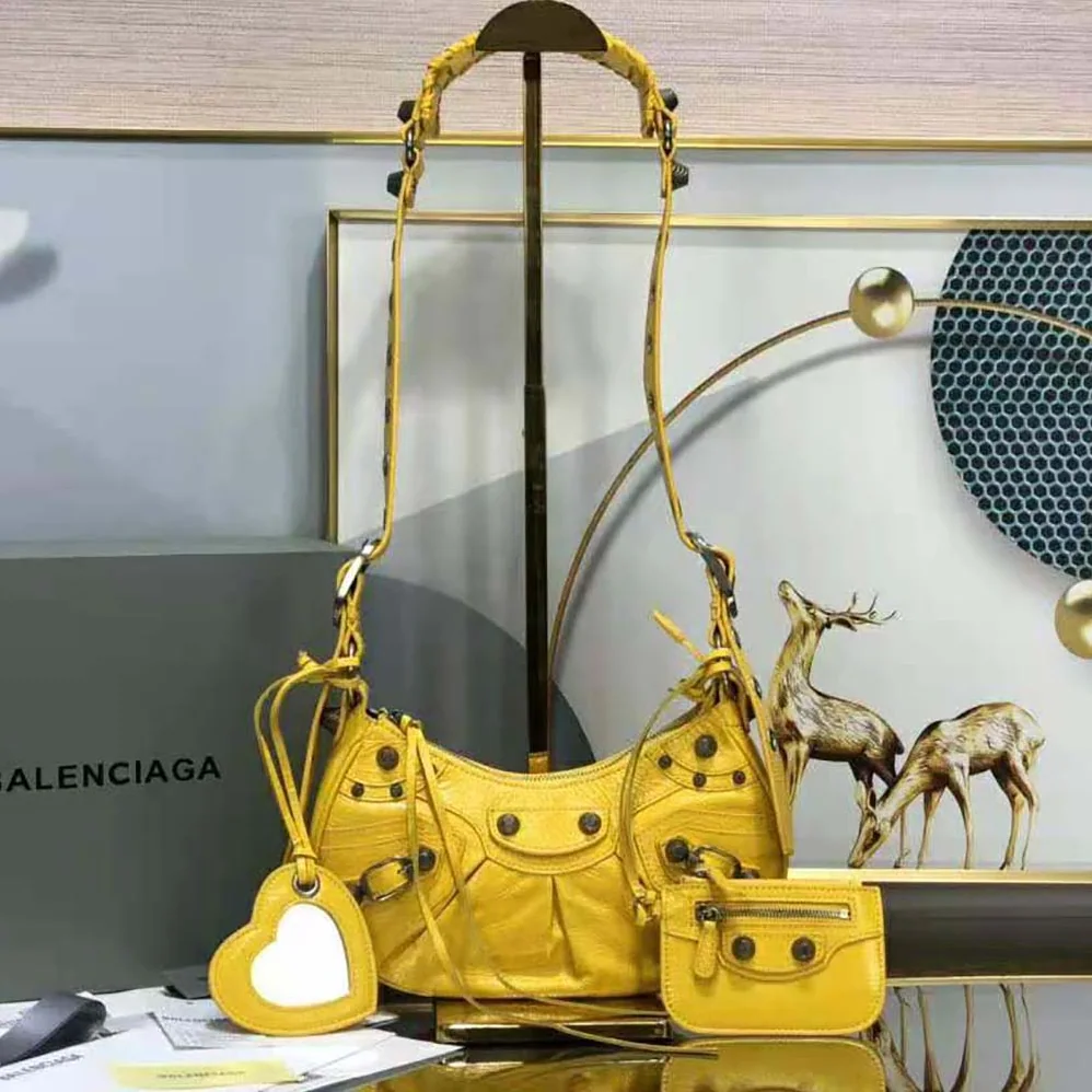 Balenciaga Le Cagole XS Shoulder Bag in Yellow for Women Balenciaga Le Cagole XS Shoulder Bag in Yellow for Women