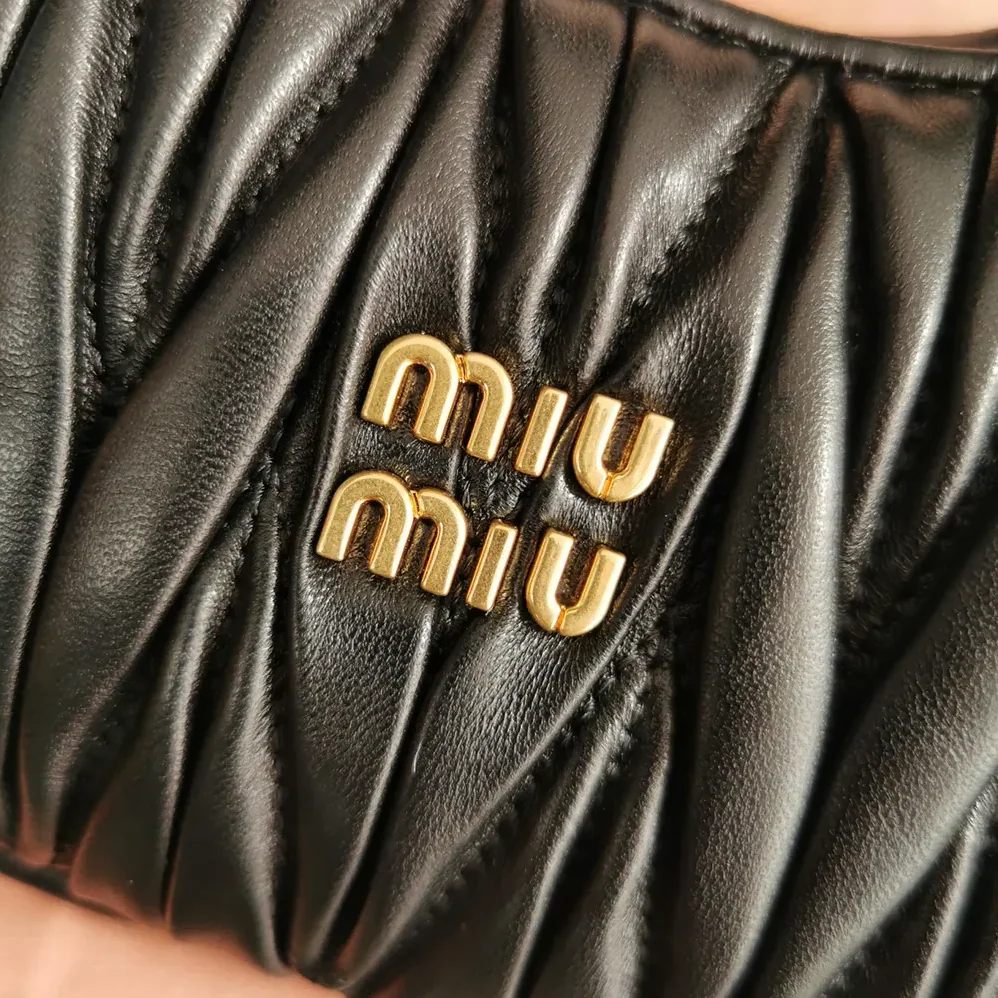 Miu Miu Wander Matelassé Nappa Leather Hobo Mini-Bag for Women in Black Miu Miu Wander Matelassé Nappa Leather Hobo Mini-Bag for Women in Black