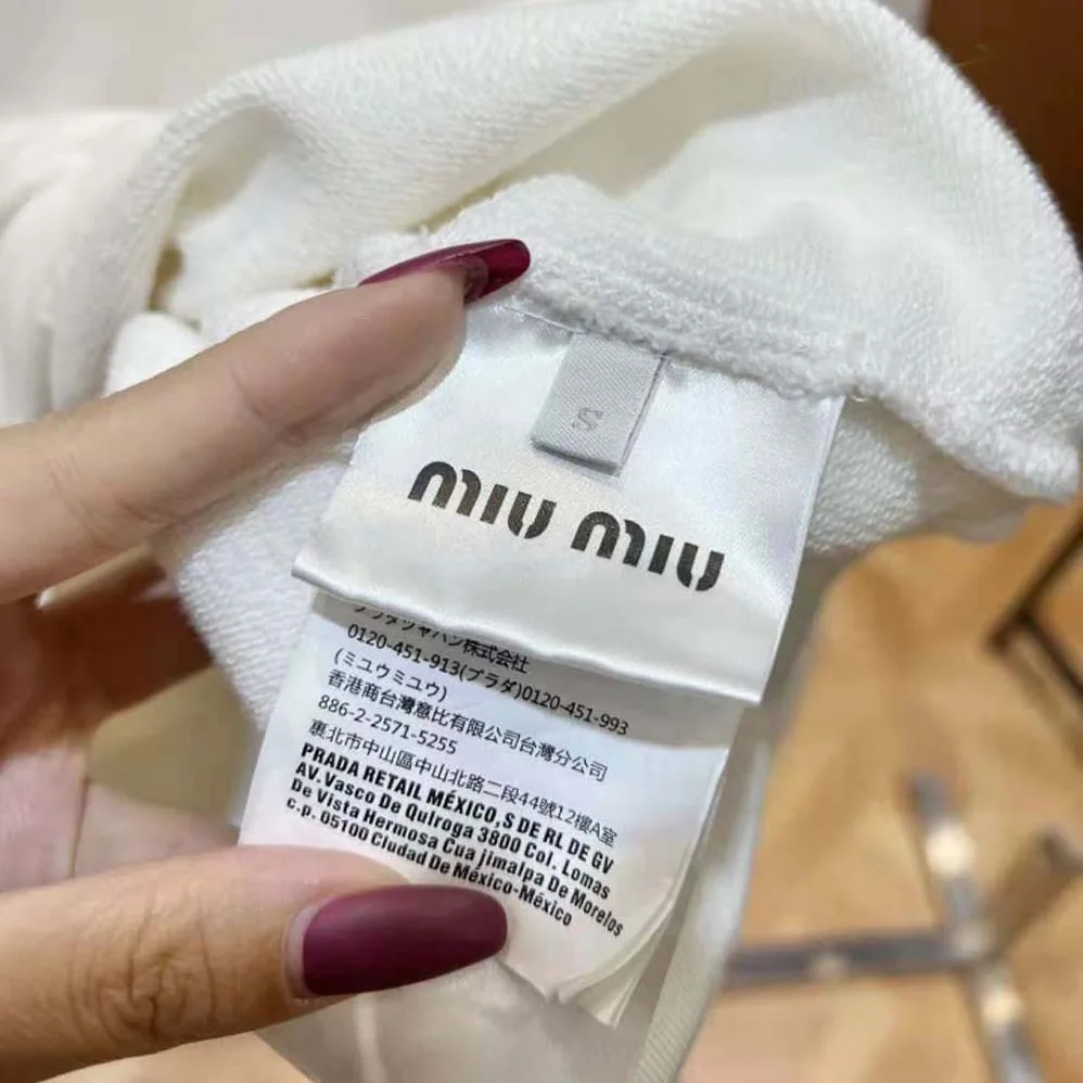 Miu Miu Cotton Polo Sweatshirt with Embroidered Logo for Women in White Miu Miu Cotton Polo Sweatshirt with Embroidered Logo for Women in White