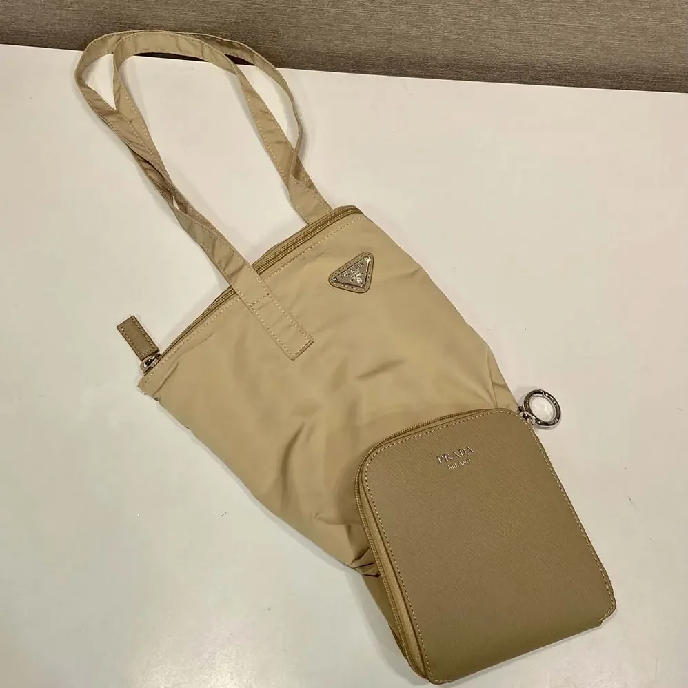 Prada Saffiano Leather Pendant With Re-Nylon Tote Bag for Women in Camel Brown Prada Saffiano Leather Pendant With Re-Nylon Tote Bag for Women in Camel Brown