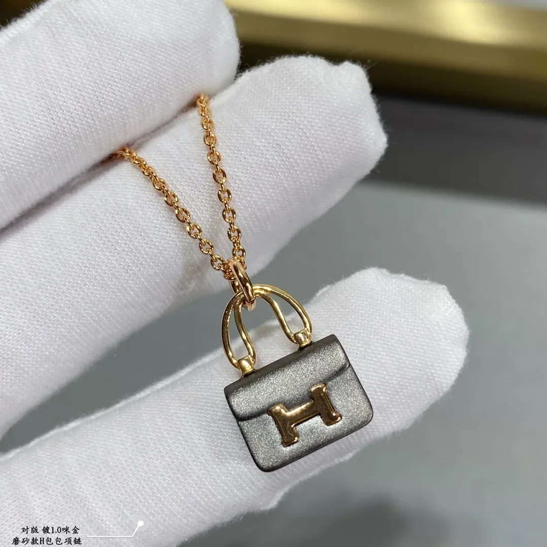 Hermes Constance Amulets Pendant Necklace Gold Tone Hermes Constance Amulets Pendant Necklace Gold Tone