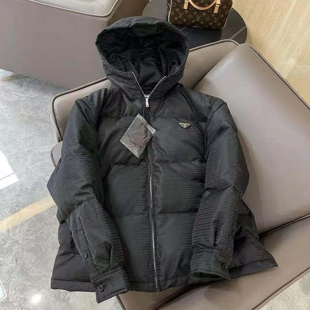 Prada Re-Nylon Hooded Down Jacket for Men in Black Prada Re-Nylon Hooded Down Jacket for Men in Black