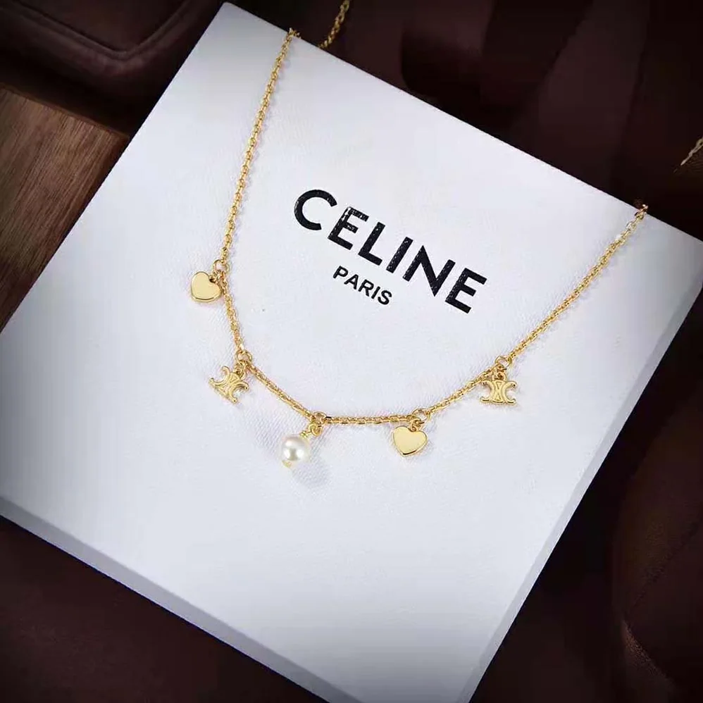 Celine Cœur Celine Charms Necklace in Brass with Gold Finish and Resin Pearl for Women Celine Cœur Celine Charms Necklace in Brass with Gold Finish and Resin Pearl for Women