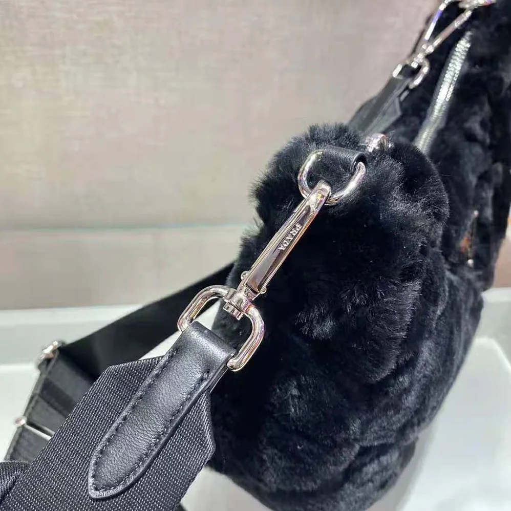 Prada A Patchwork-style Triangle Motif Characterizes Shearling Shoulder Bag for Women in Black Prada A Patchwork-style Triangle Motif Characterizes Shearling Shoulder Bag for Women in Black