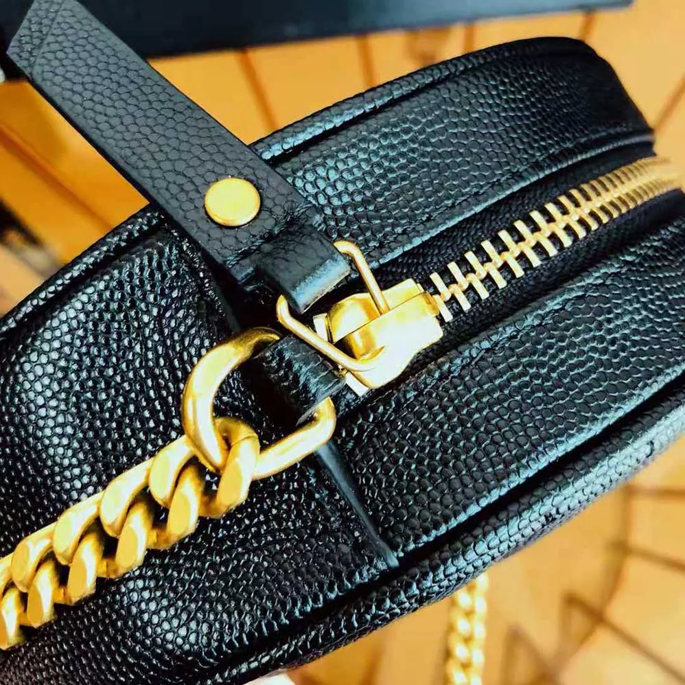 Saint Laurent YSL Vinyle Round Camera Bag in Chevron-Quilted Grain de Poudre Embossed Leather for Women in Black Saint Laurent YSL Vinyle Round Camera Bag in Chevron-Quilted Grain de Poudre Embossed Leather for Women in Black