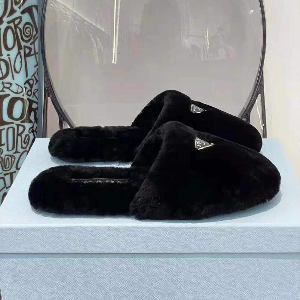 Prada Enameled Triangle Logo Accentuates Shearling Sabots for Women