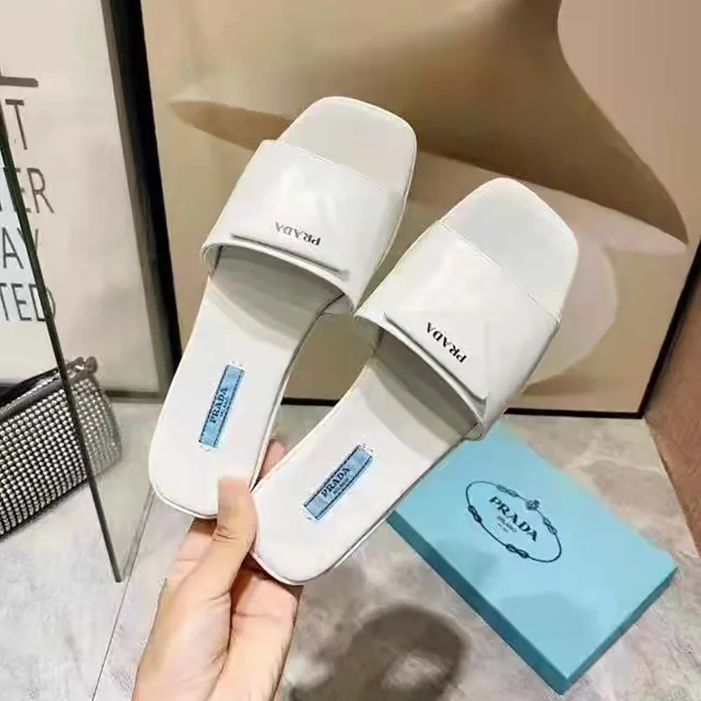 Prada Brushed Leather Slides Triangle Logo for Women in White Prada Brushed Leather Slides Triangle Logo for Women in White