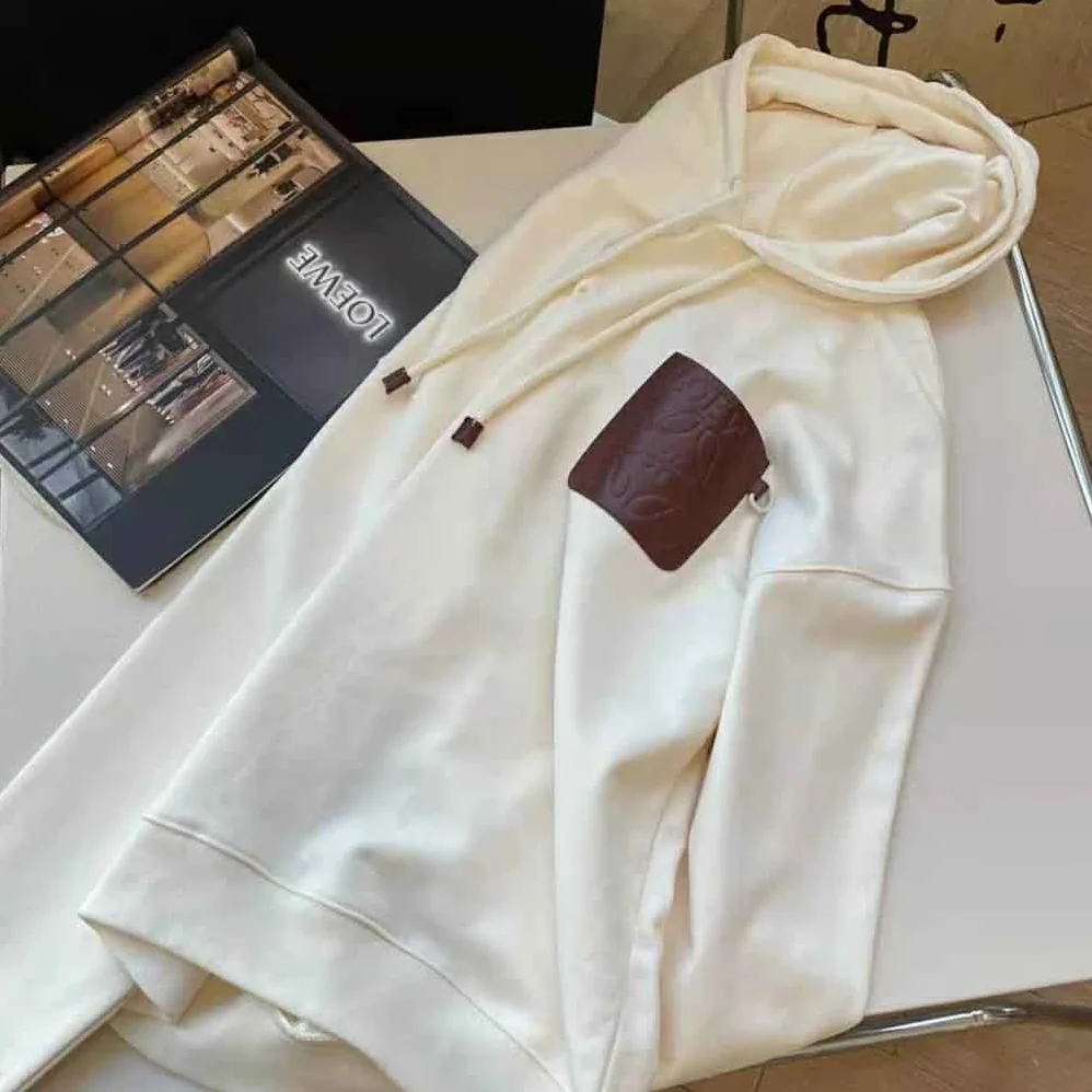 Loewe Anagram Patch Hoodie in Cotton for Women in White Loewe Anagram Patch Hoodie in Cotton for Women in White