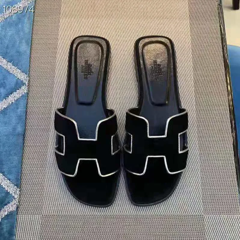 Hermes Oran Sandal in Velvet and Nappa Leather with Metallic Finish and Iconic “H” Cut-Out for Women in Black Hermes Oran Sandal in Velvet and Nappa Leather with Metallic Finish and Iconic “H” Cut-Out for Women in Black
