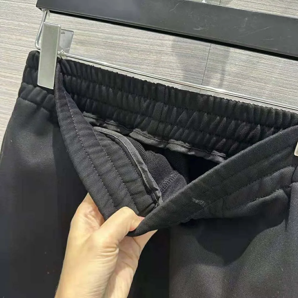 Prada Cotton Fleece Joggers with Feather Trim for Women in Black Prada Cotton Fleece Joggers with Feather Trim for Women in Black