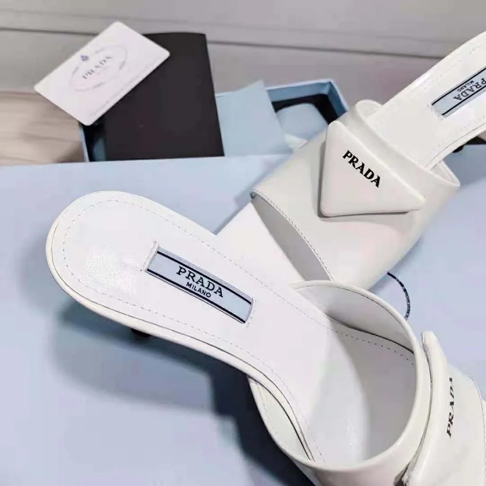 Prada Brushed Leather Mid-heeled Slides in 65mm Heel for Women in White Prada Brushed Leather Mid-heeled Slides in 65mm Heel for Women in White