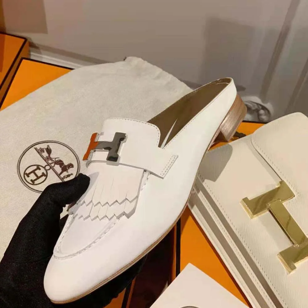 Hermes Rivoli Mule Mule in Calfskin with Fringe Detail for Women in White Hermes Rivoli Mule Mule in Calfskin with Fringe Detail for Women in White