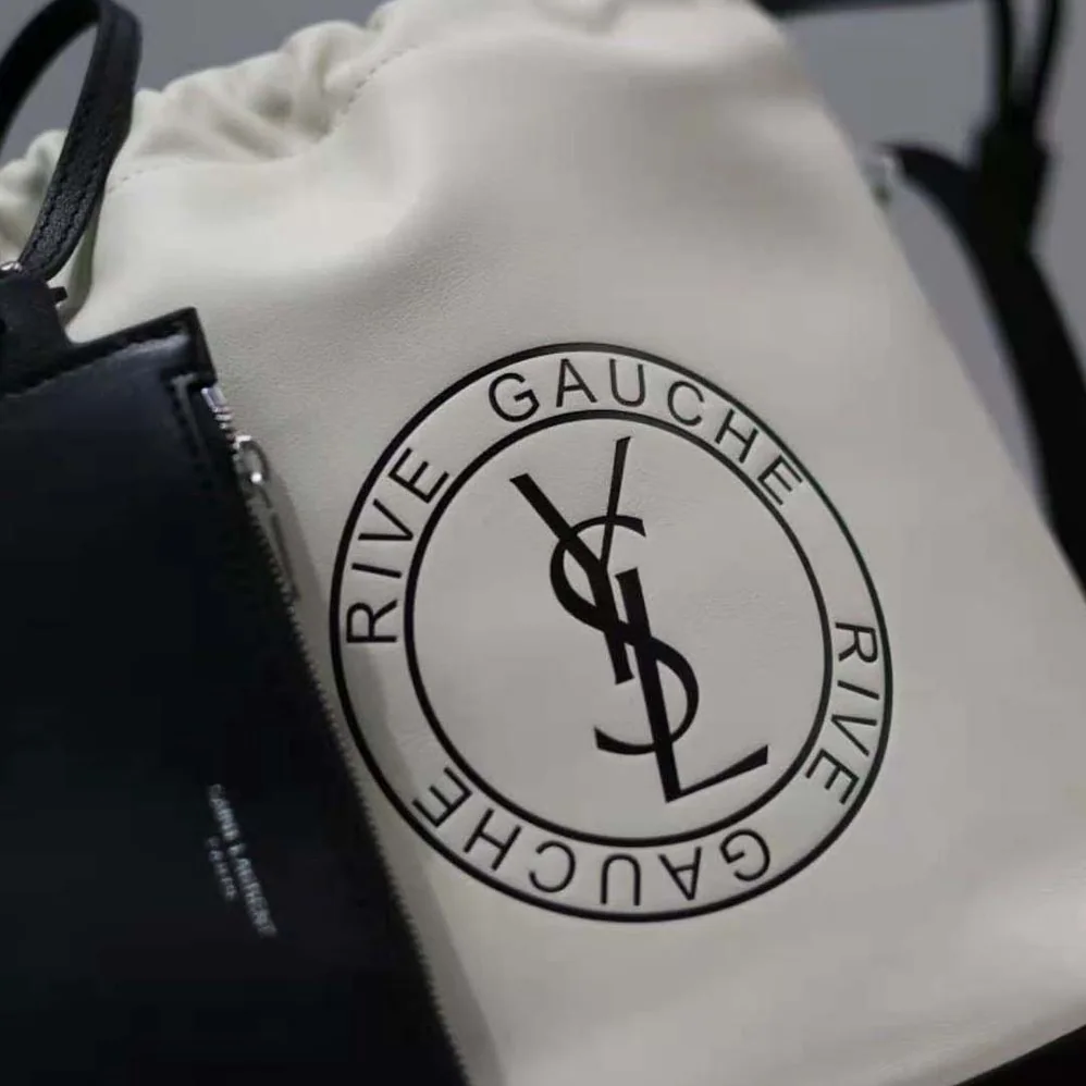 Saint Laurent YSL Rive Gauche Laced Bucket Bag in Smooth Leather for Men in Beige