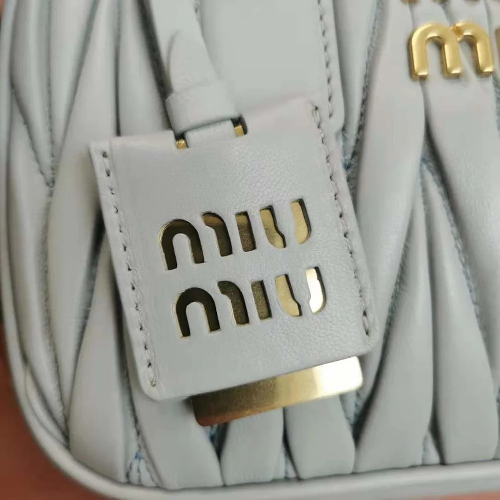 Miu Miu Matelassé Nappa Leather Top-Handle Bag for Women in Silver Miu Miu Matelassé Nappa Leather Top-Handle Bag for Women in Silver