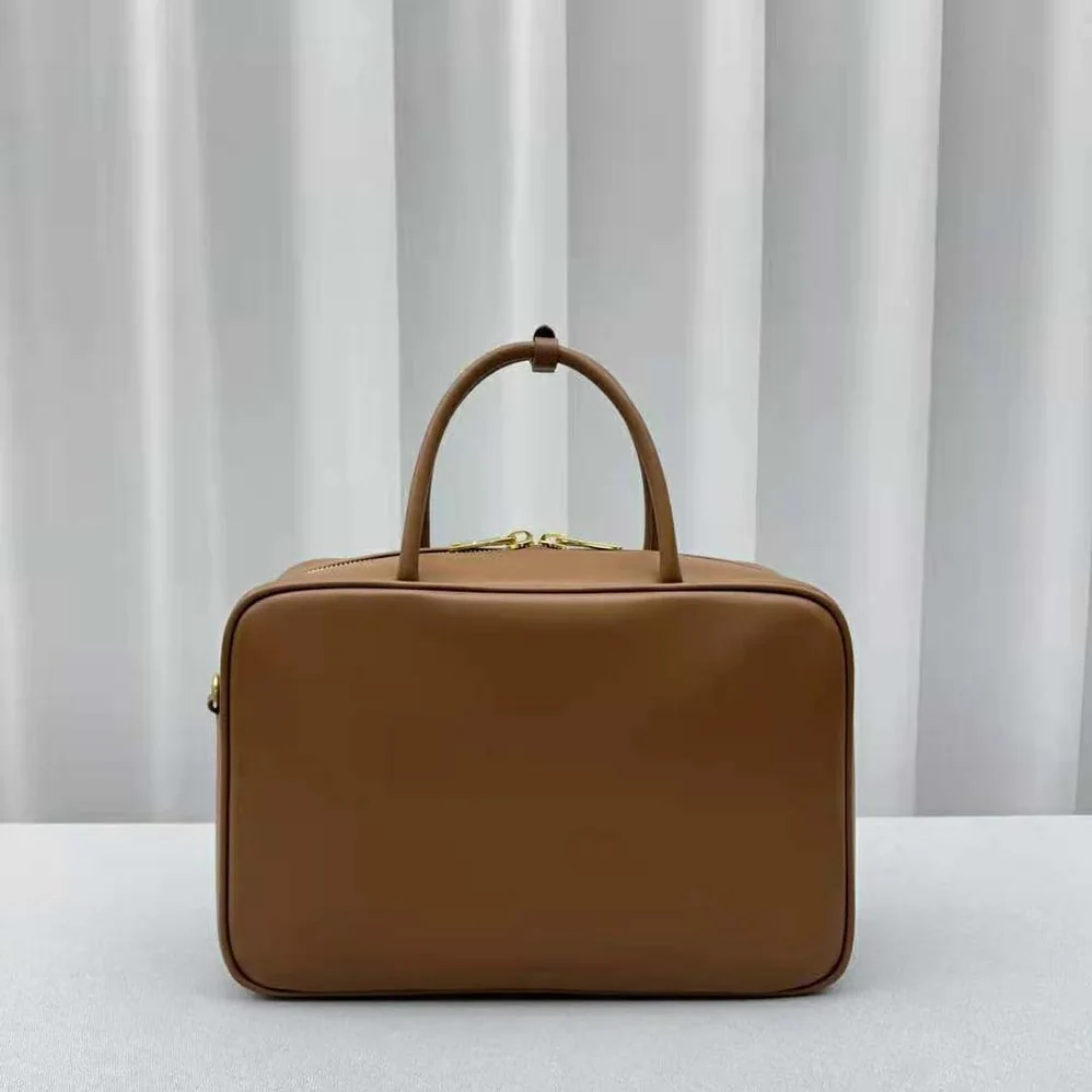 Miu Miu Leather Top-handle Bag with Embossed Lettering Logo for Women in Brown Miu Miu Leather Top-handle Bag with Embossed Lettering Logo for Women in Brown