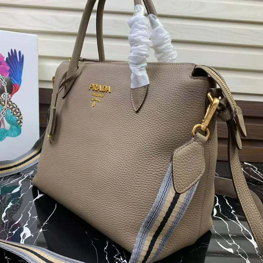 Prada Leather Handbag with Metal lettering Logo on the Front for Women in Beige Prada Leather Handbag with Metal lettering Logo on the Front for Women in Beige
