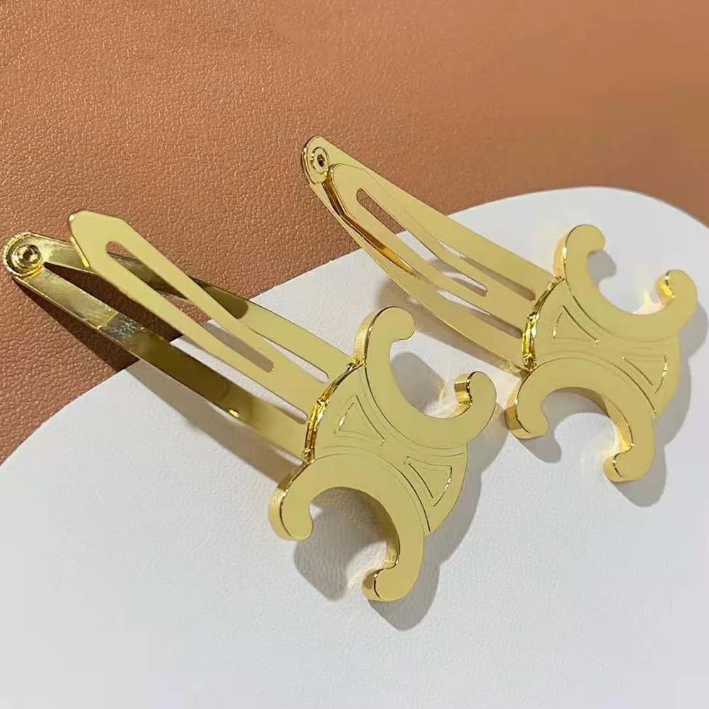 Celine Hair Accessories Set of 2 Triomphe Snap Hair Clips in Brass with Gold Finish and Steel for Women Celine Hair Accessories Set of 2 Triomphe Snap Hair Clips in Brass with Gold Finish and Steel for Women