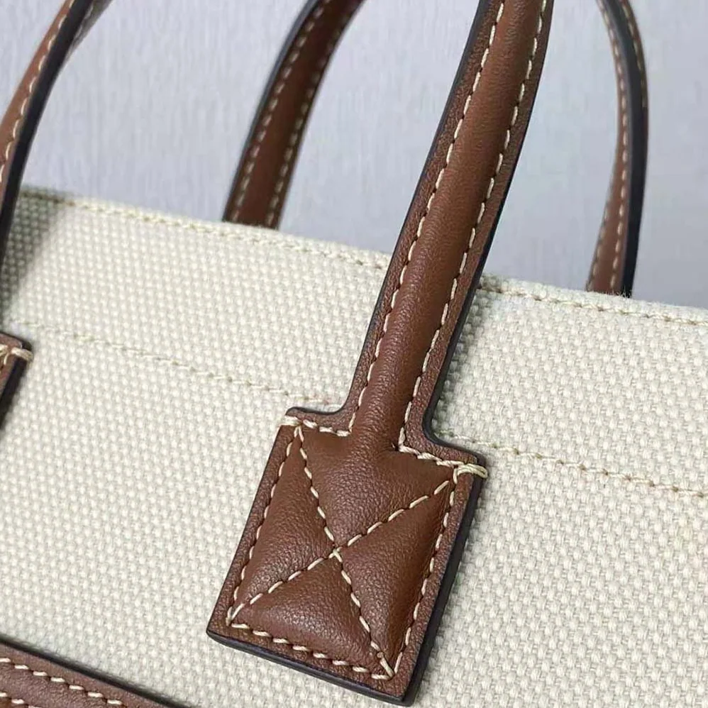 Burberry Mini Two-tone Canvas and Leather Freya Bag for Women in Brown Burberry Mini Two-tone Canvas and Leather Freya Bag for Women in Brown