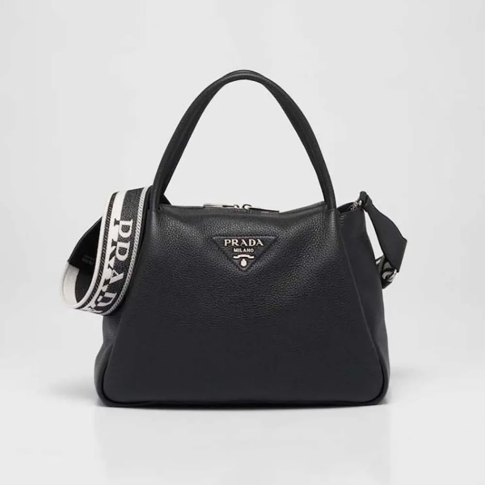 Prada Large Leather Handbag with the Prada Metal Lettering Logo Gleaming at Its Center for Women in Black Prada Large Leather Handbag with the Prada Metal Lettering Logo Gleaming at Its Center for Women in Black