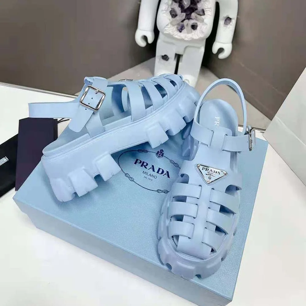 Prada Foam Rubber Sandals with Enameled Metal Triangle Logo for Women in Blue Prada Foam Rubber Sandals with Enameled Metal Triangle Logo for Women in Blue