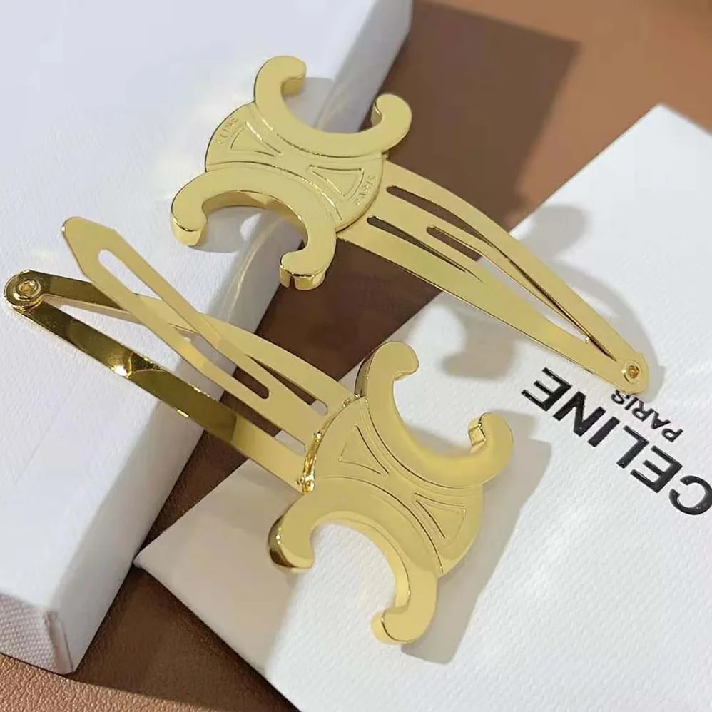 Celine Hair Accessories Set of 2 Triomphe Snap Hair Clips in Brass with Gold Finish and Steel for Women Celine Hair Accessories Set of 2 Triomphe Snap Hair Clips in Brass with Gold Finish and Steel for Women